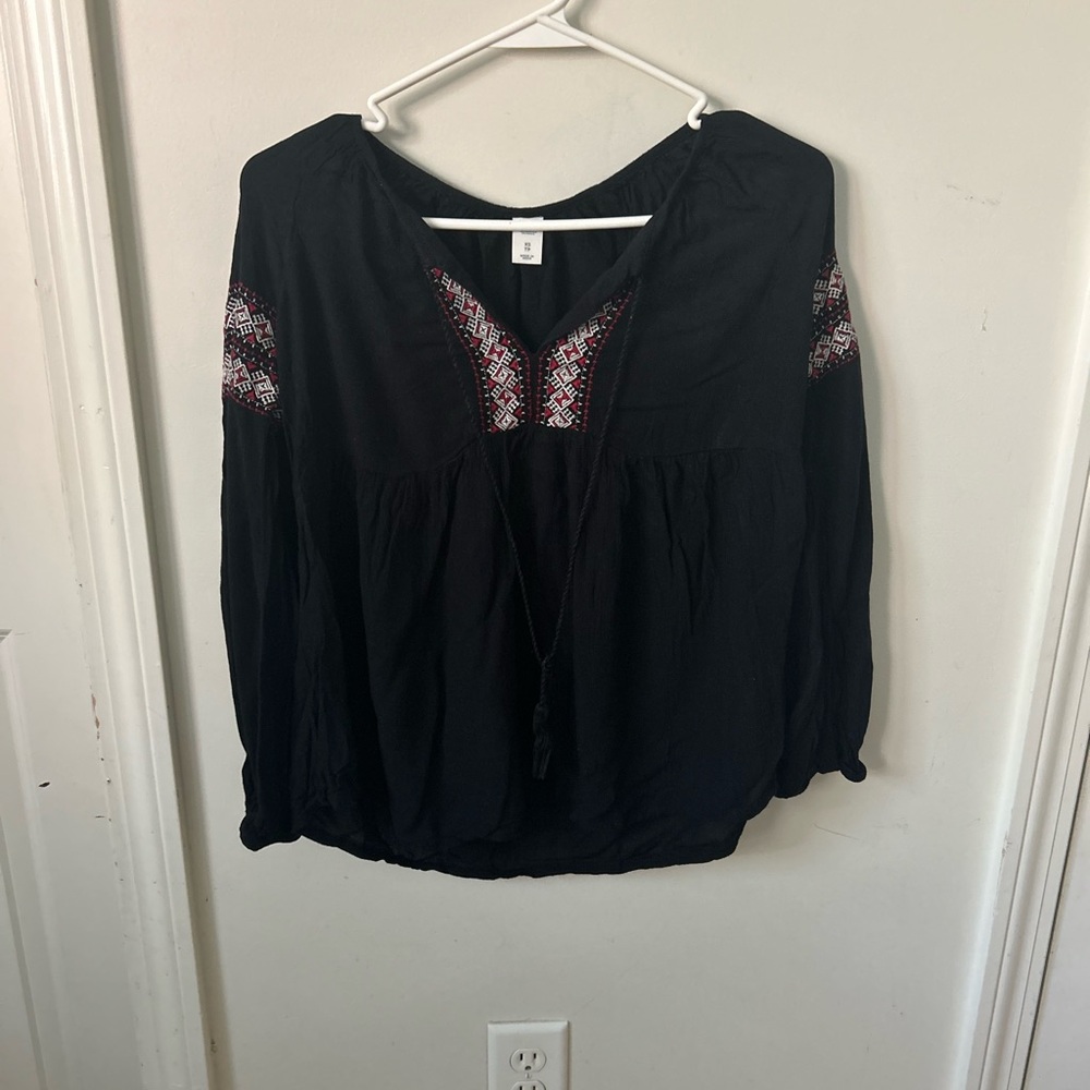 Black Blouse with red and white patterns on the front and sleeves